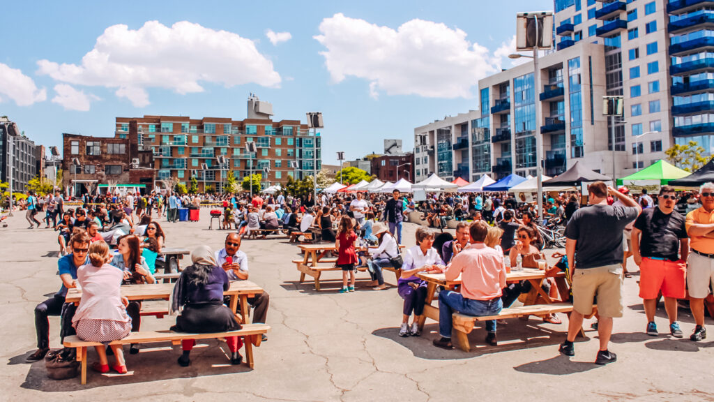 People having food at Smorgasburg, one of the best date ideas in Williamsburg