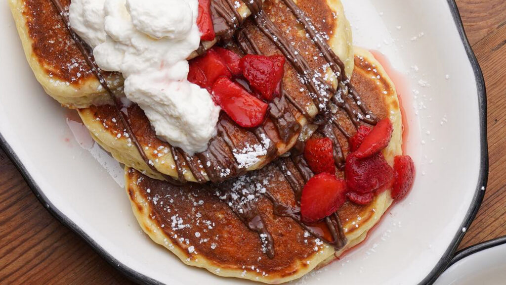 Pancakes on a plate at Bubby's, one of the best brunch spots in Tribeca