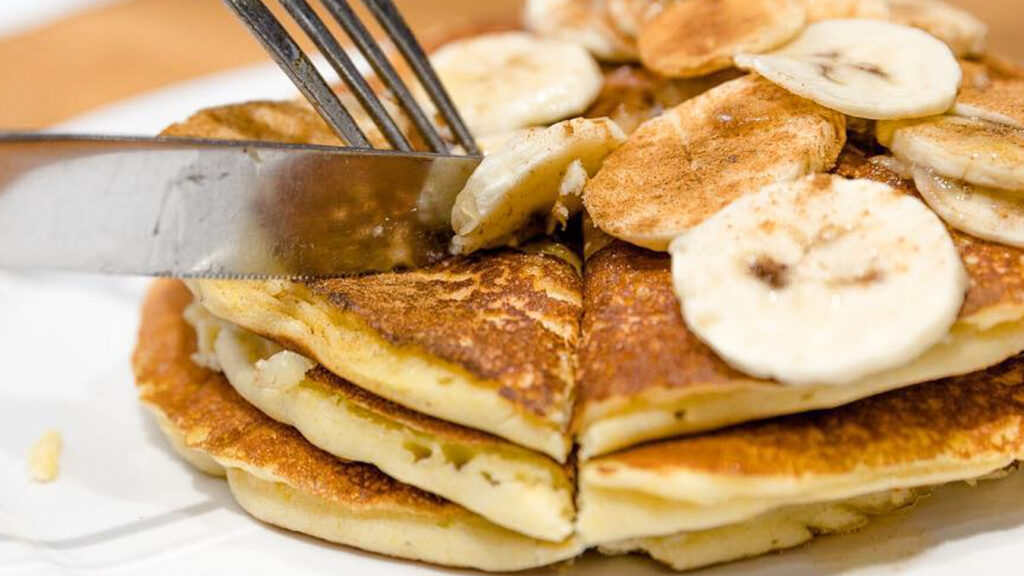 Pancakes with banana at Mansion Diner, one of the best breakfast spots on the Upper East Side